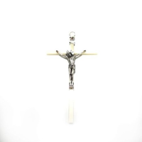 Een lichtend PVC kruis met een metaal Christus. 21 cm