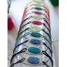 Bracelet cordon double avec médaille dorée émaillée