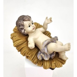 Statue de l’enfant Jésus sur son lit en résine. 15 cm