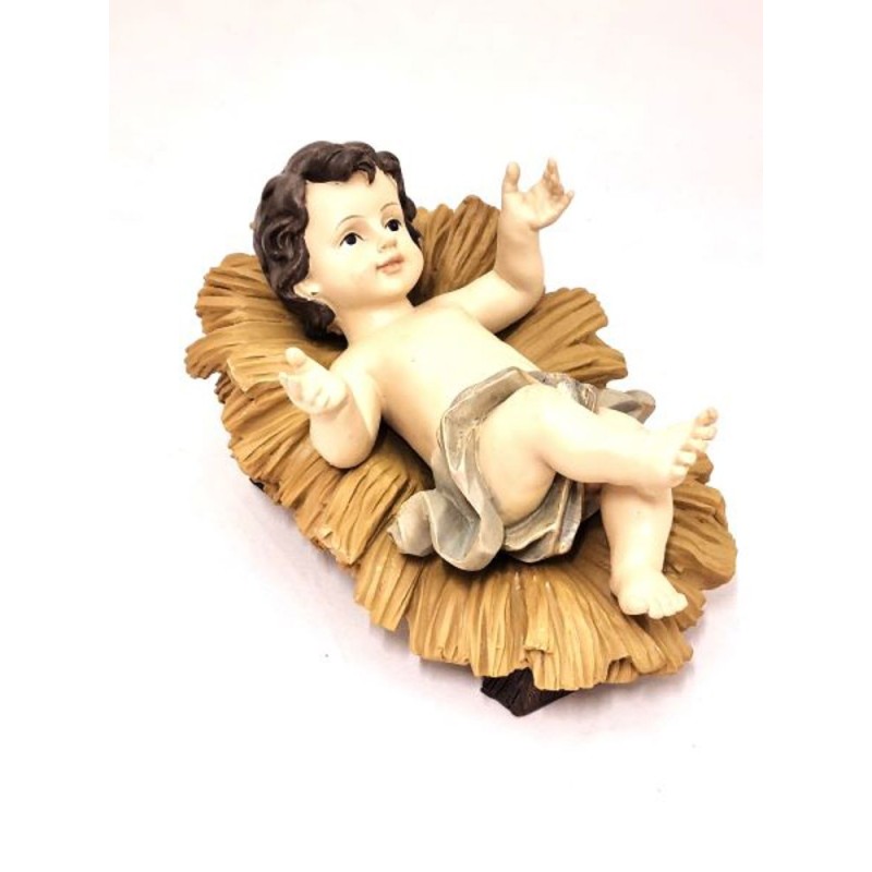 Statue de l’enfant Jésus sur son lit en résine. 23 cm