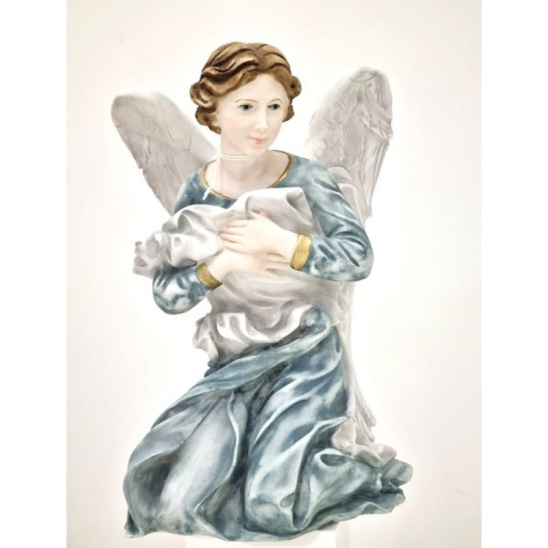 Statue peinte d'un ange à genoux en porcelaine. 40 cm